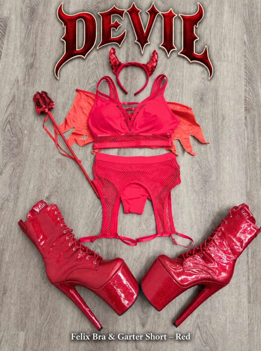 Devil Halloween pole costume flat lay with the RARR Felix Bra and Garter Short in Red, sequin horn headband, wings, pitchfork and red glitter platform boots
