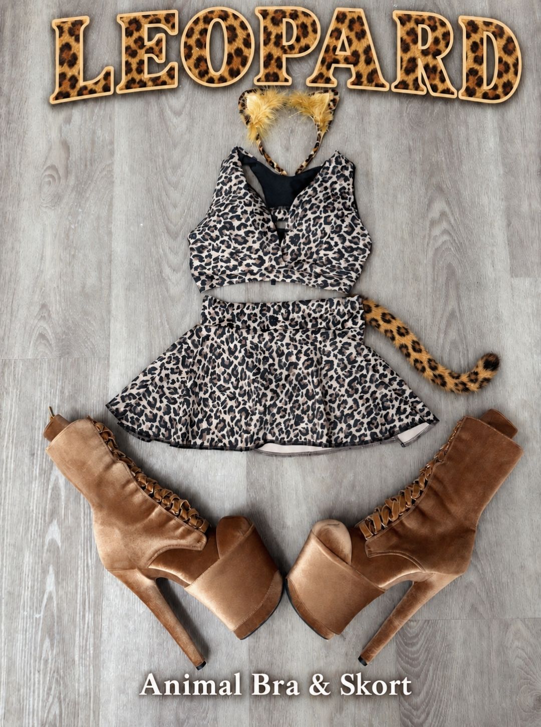 Leopard Halloween pole costume flat lay with the RARR Animal Print Bra and Dance Skort, cat ear headband, leopard tail and tan velvet platform boots