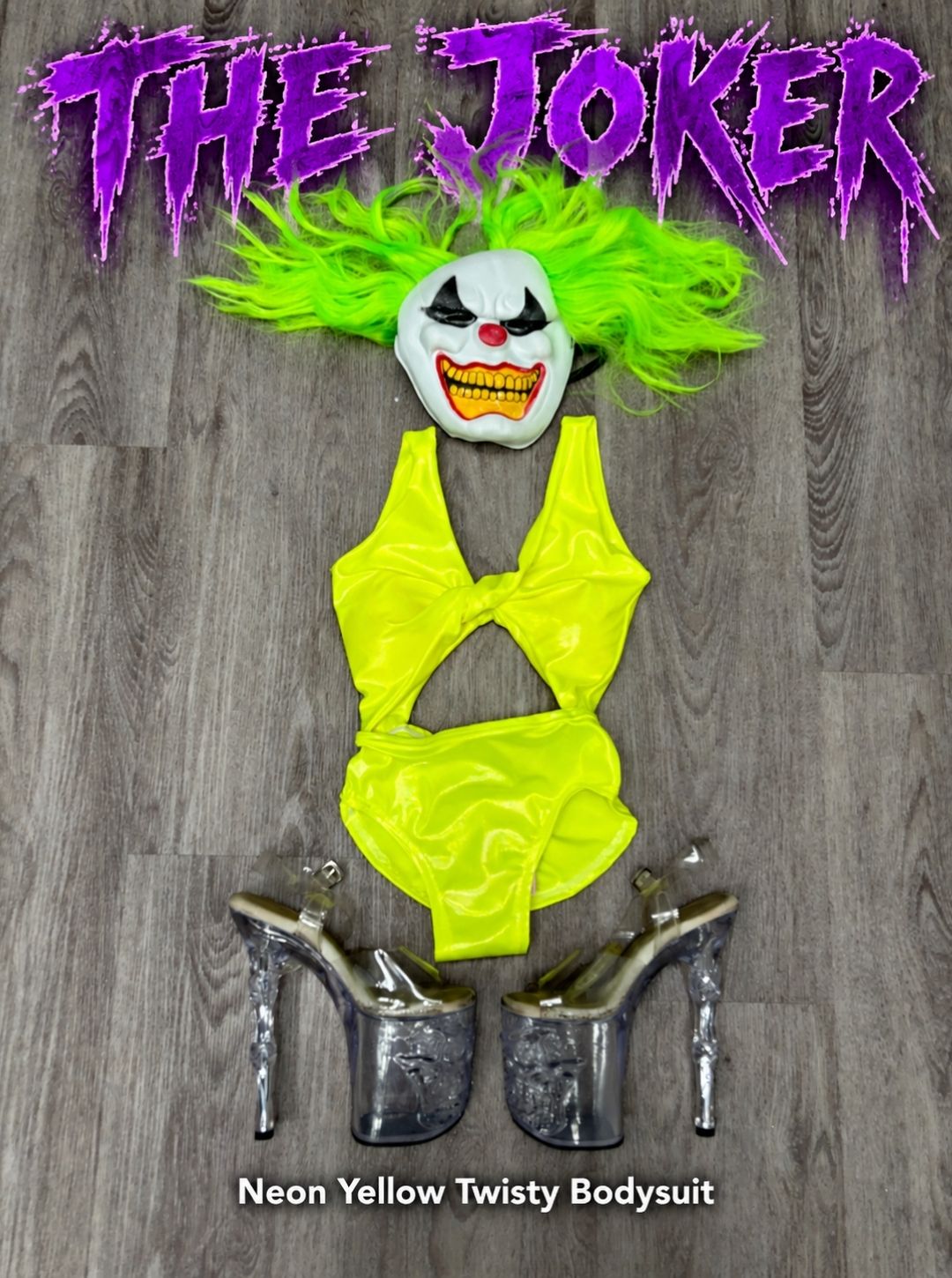 Joker inspired Halloween pole costume flat lay with the RARR Neon Yellow Twisty Bodysuit, green wig, clown mask and clear skull platform heels